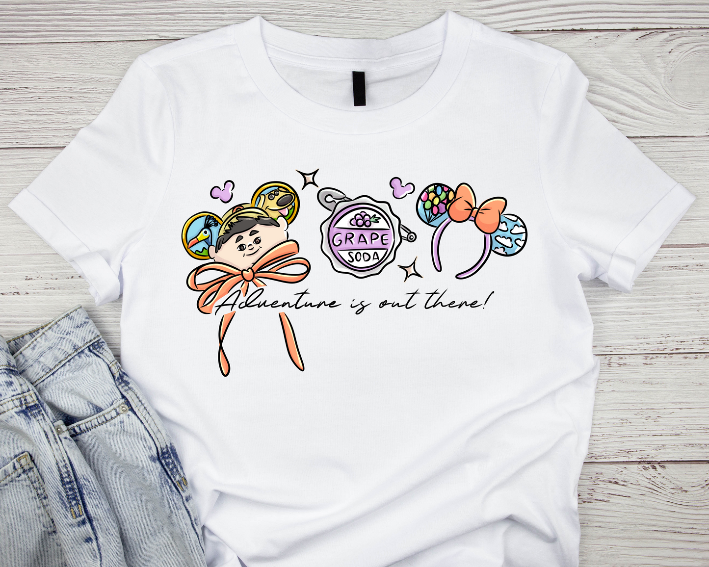 “Adventure Is Out There” Graphic T-Shirt – Enchanted Balloon & Grape Soda Design